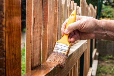 Applying Stain to Fence